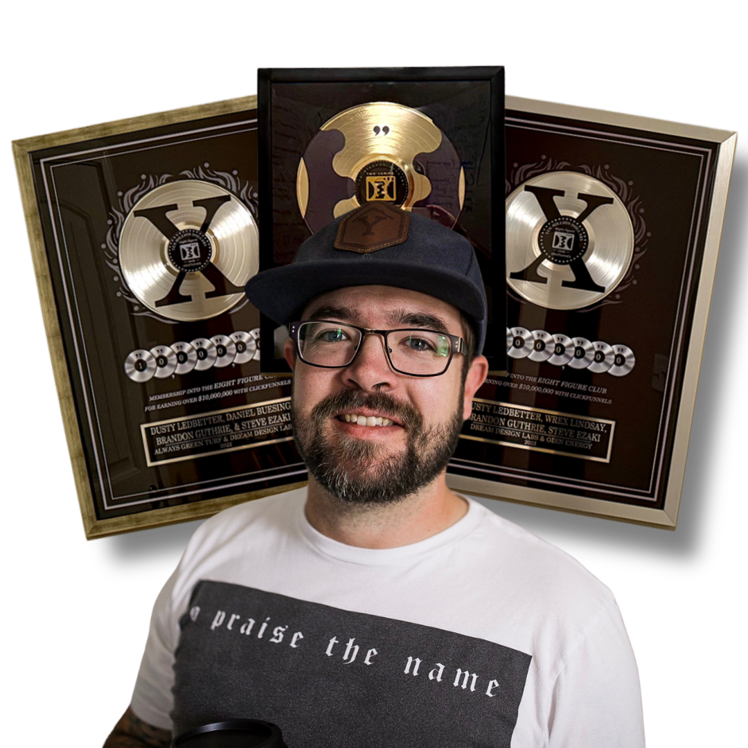 Dusty Ledbetter, founder of Creative Intelligence Tool, with his ClickFunnels Two Comma Club X awards